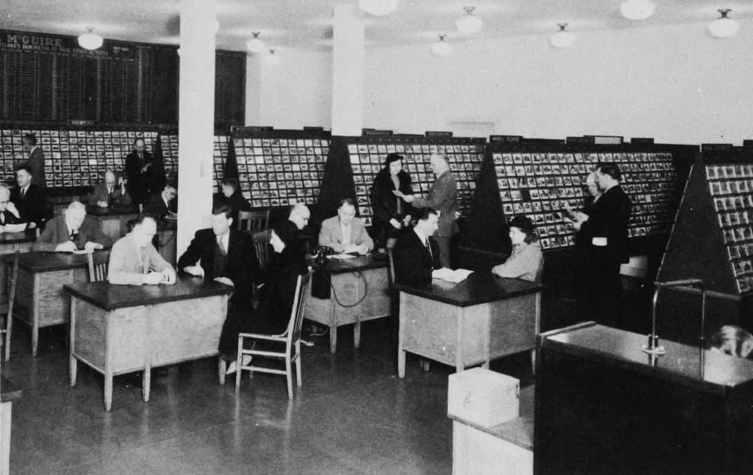 Historic photo of an early real estate listing exchange office