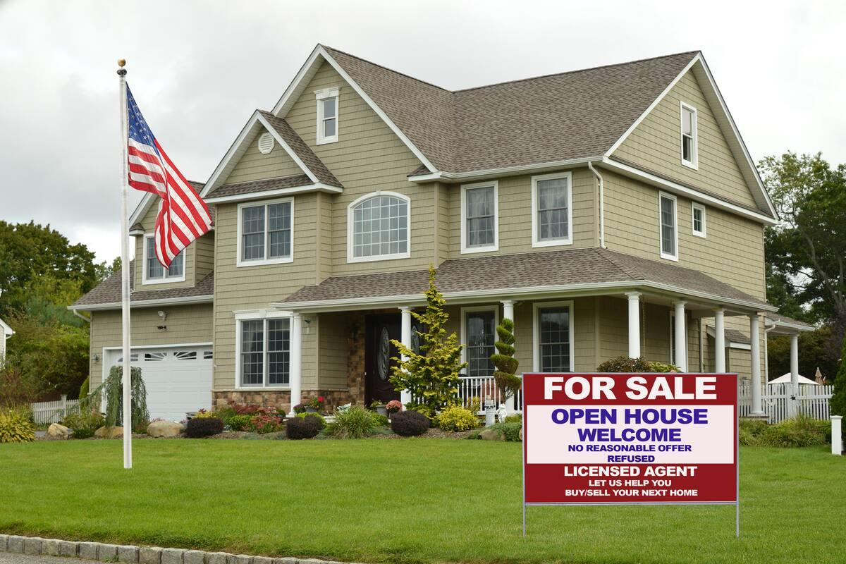 Single-family home with an open house For Sale sign
